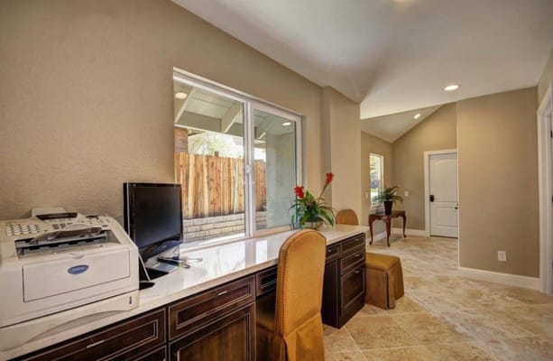 Interior view of a common area with desk and chairs