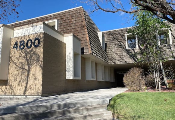 Exterior view of the facility building with entrance