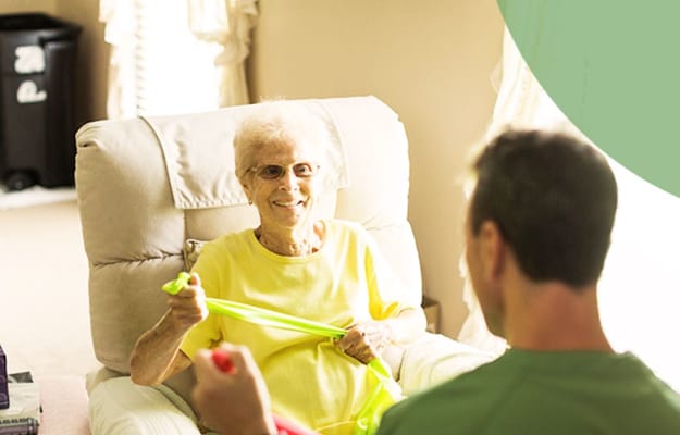 Resident engaged in a physical activity session with staff