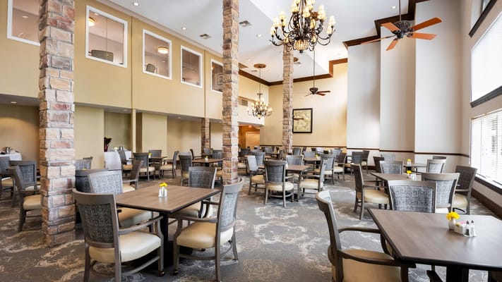 Bright dining room with tables and chairs