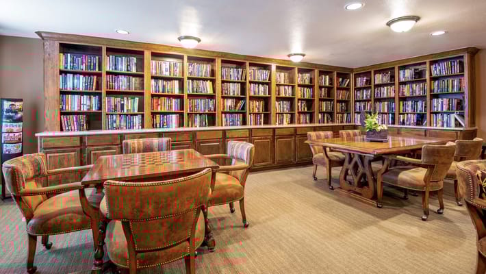Cozy library with bookshelves and seating areas