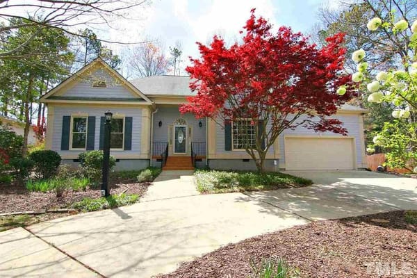 Exterior view of a senior living facility with landscaping