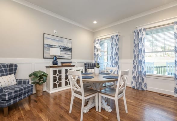 Bright common area with dining table and seating