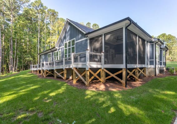 Exterior view of a senior living facility surrounded by greenery