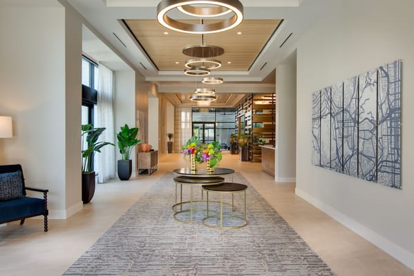 Bright and modern lobby area with floral arrangement
