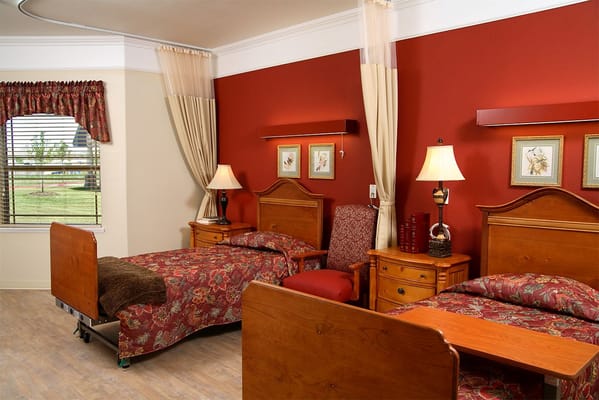 Cozy resident room with two beds and warm decor