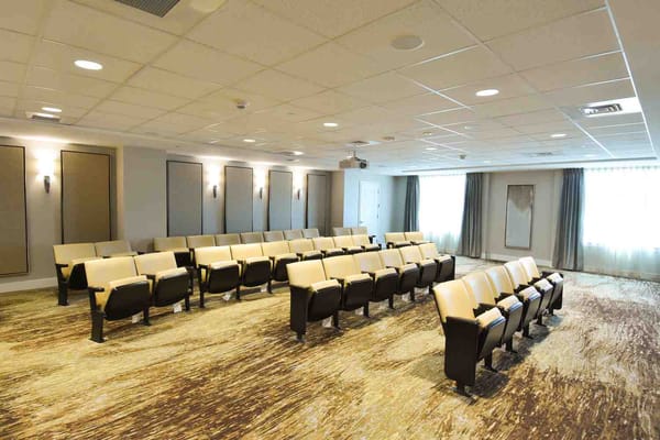 Seating arrangement in the auditorium of Belmont Village Senior Living Albany