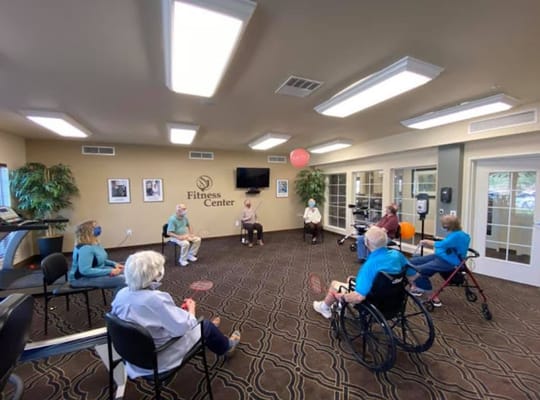 Residents participating in an exercise class in the fitness center