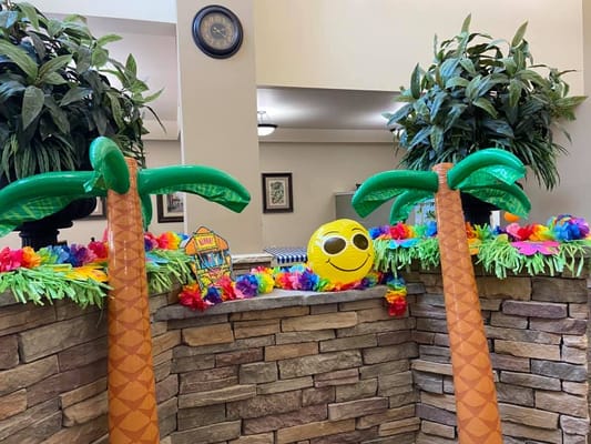 Interior decorations with inflatable palm trees and tropical theme
