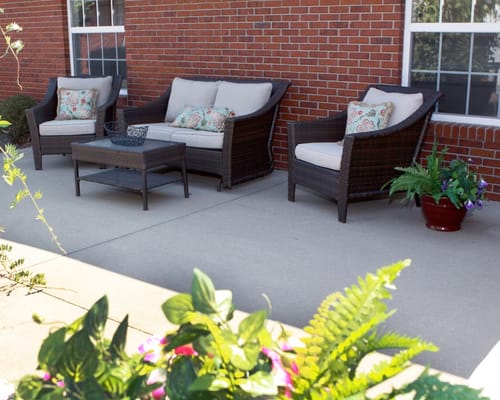 Outdoor seating area with comfortable chairs and plants