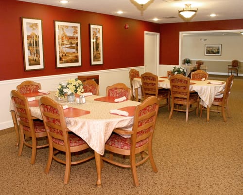 Dining area with tables and floral arrangements