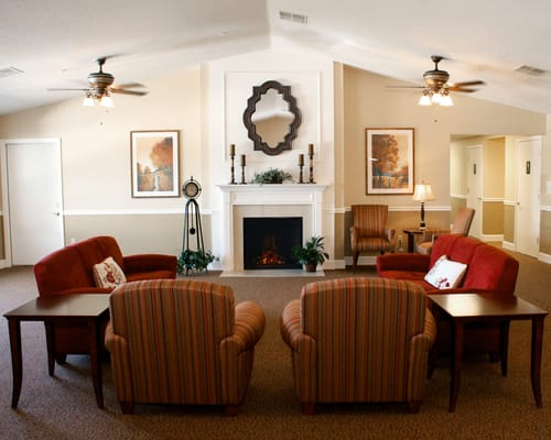 Bright common area with comfortable seating and fireplace