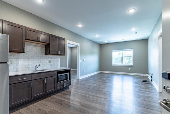 Interior view of a well-lit kitchen and living area