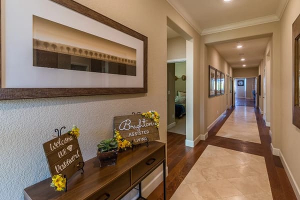 Bright, welcoming hallway with signs for residents