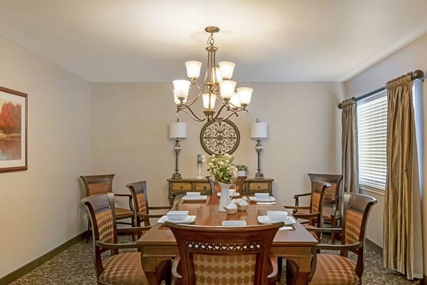 Elegant dining room setup with a chandelier