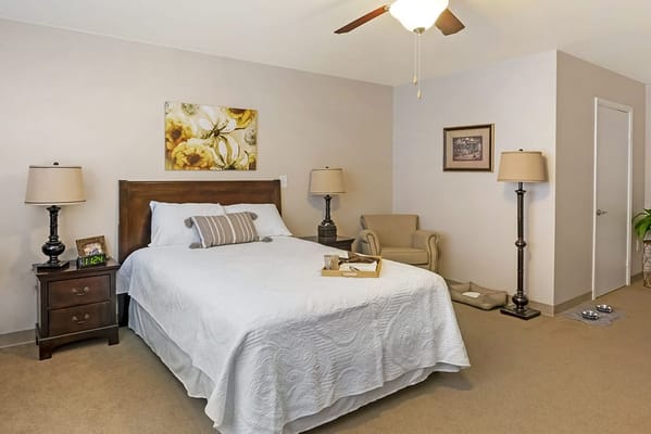 Cozy private resident room with bed and armchair