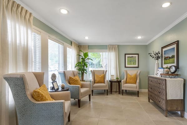 Bright sitting area with comfortable chairs and decor