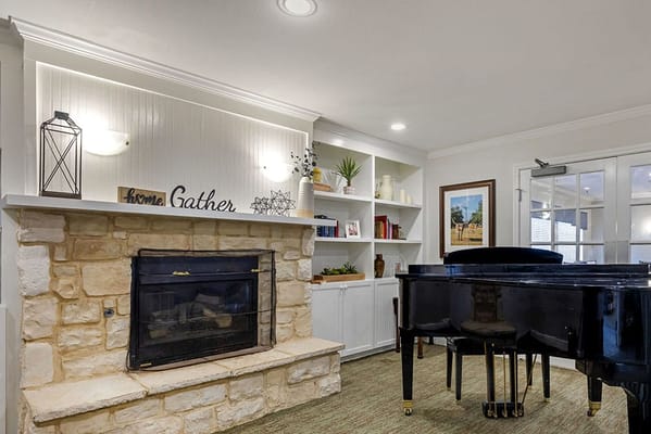 Cozy common area with a piano and warm decor