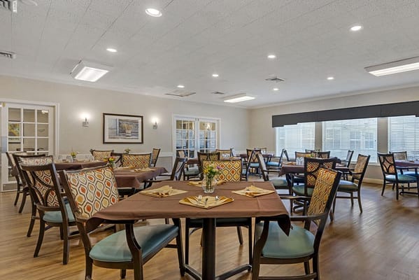 Dining area with tables and colorful chairs