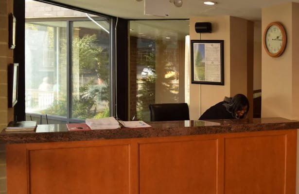 Reception area with staff member at the desk