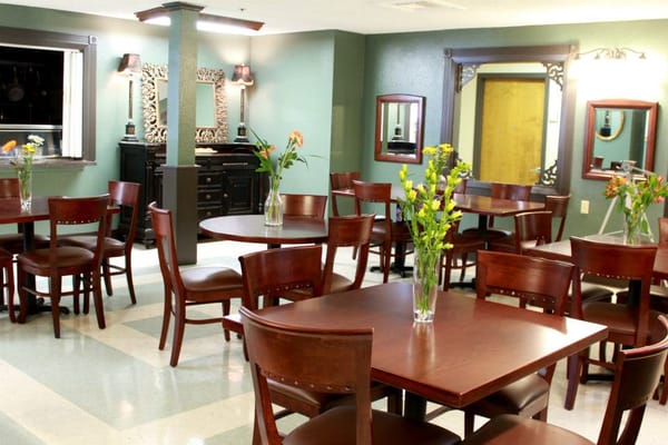 Interior dining area with tables and flowers