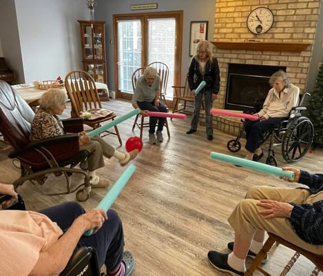 Residents participating in a group activity in a common area