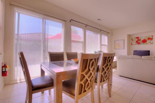 Bright dining area with large windows