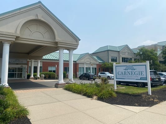 View of the entrance and signage at Carnegie Assisted Living Facility