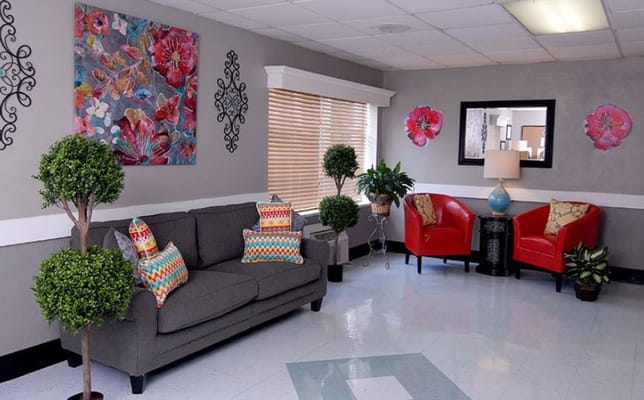 Bright lounge area with colorful decor and plants