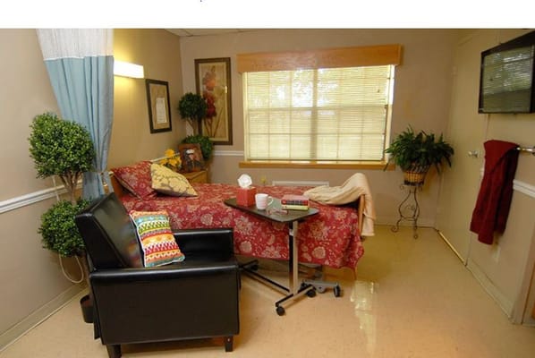 Cozy resident room with a bed and seating area