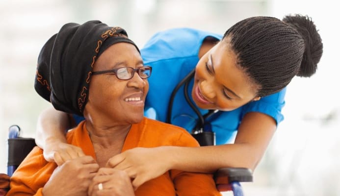 Caregiver interacting with a resident in a facility
