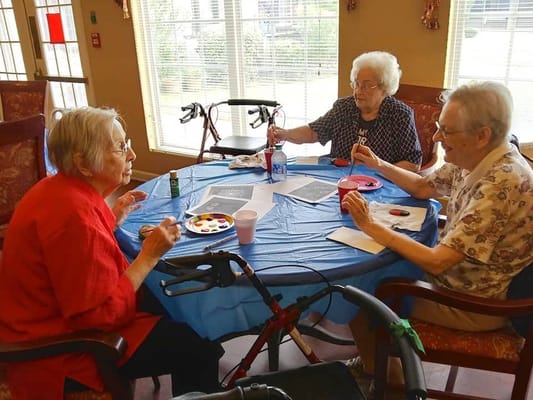 Residents participating in a painting activity.