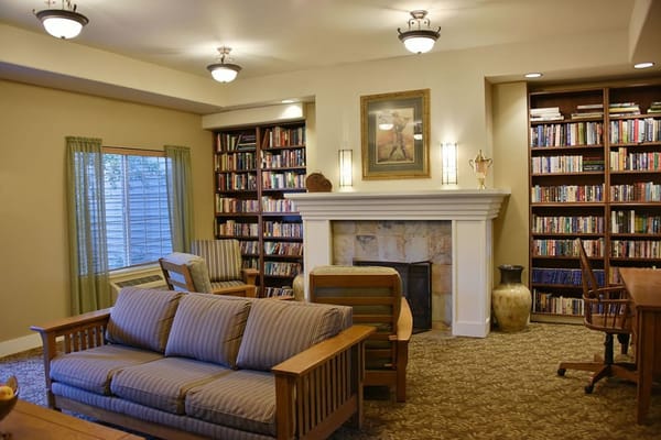 Inviting living room with bookshelves and seating area