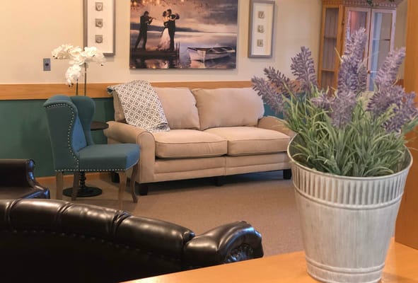 Cozy seating area in a common space with decorative elements