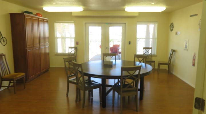 Bright common area with table and chairs