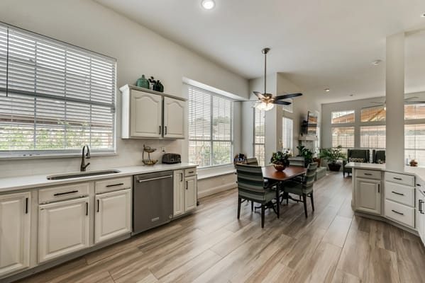 Bright kitchen with dining table and modern appliances
