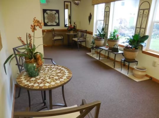 Bright interior common area with plants and seating
