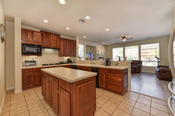 Spacious kitchen with wooden cabinets and modern appliances