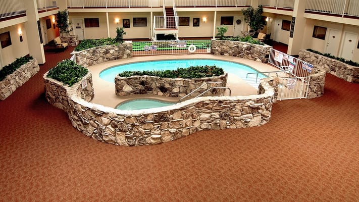 Aerial view of the indoor pool with stone landscaping