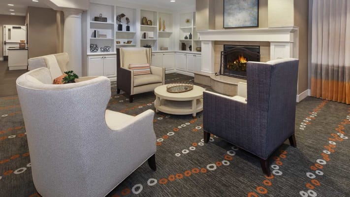Cozy common area with seating and fireplace