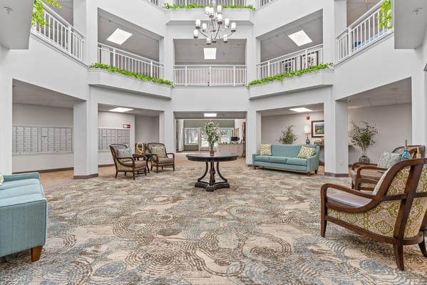 Spacious lobby with seating area and decorative plants