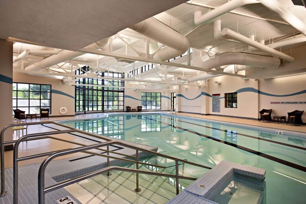 Indoor swimming pool area with large windows