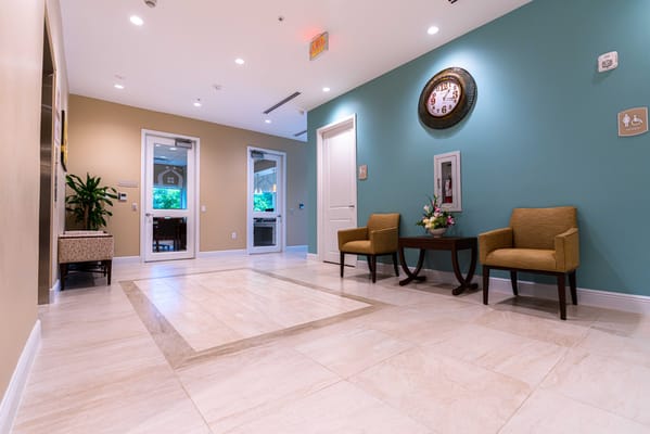 A bright interior lobby with seating and decorations