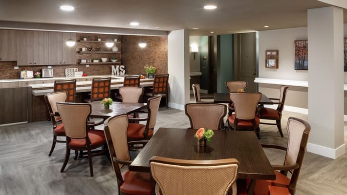 Dining area with tables and chairs in a welcoming interior
