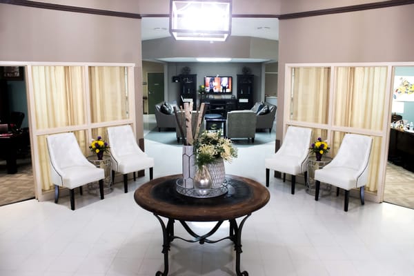 Welcoming lobby with seating and floral arrangements