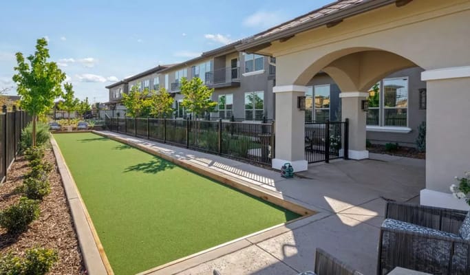 Outdoor space with manicured lawn and building exterior