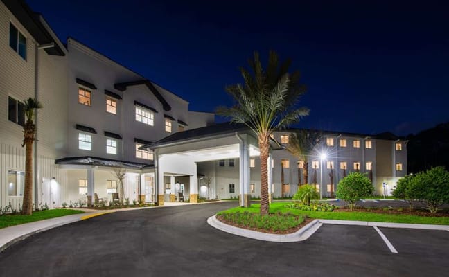 Exterior view of Paradise Pointe Assisted Living at night
