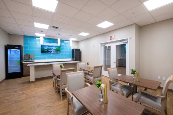 Bright common area with tables and seating
