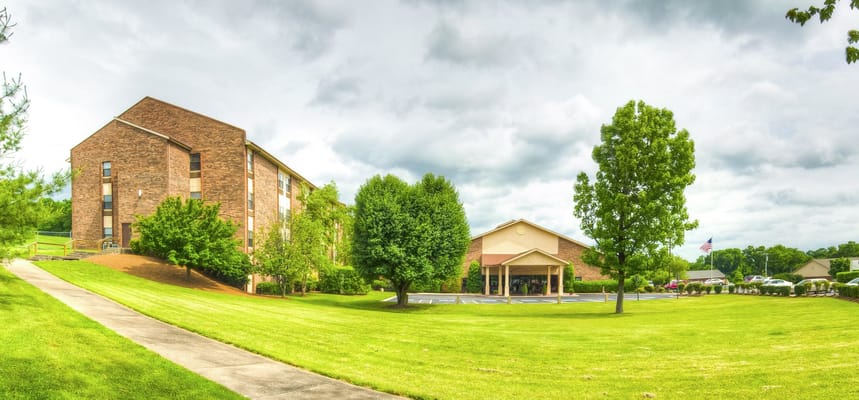 Exterior view of Park Place Retirement Community with landscaped grounds