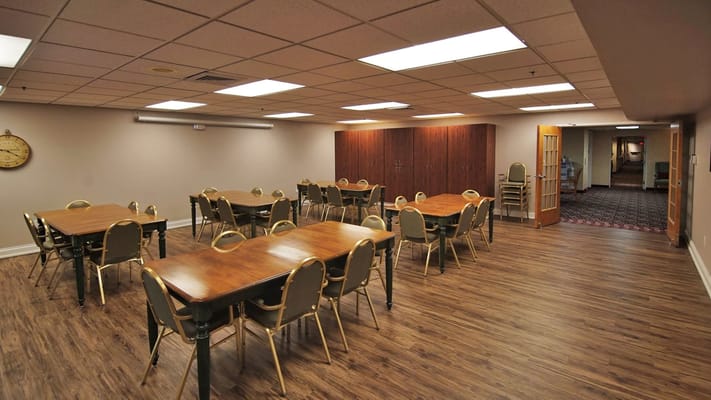 Interior of a common area with tables and chairs